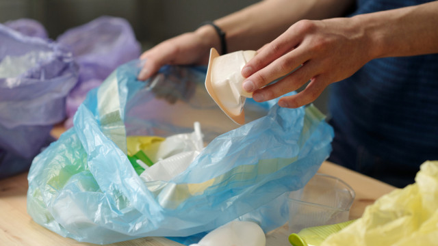 hand-of-adolescent-guy-putting-white-small-plastic-2025-03-13-09-43-56-utc (1) (1).jpg